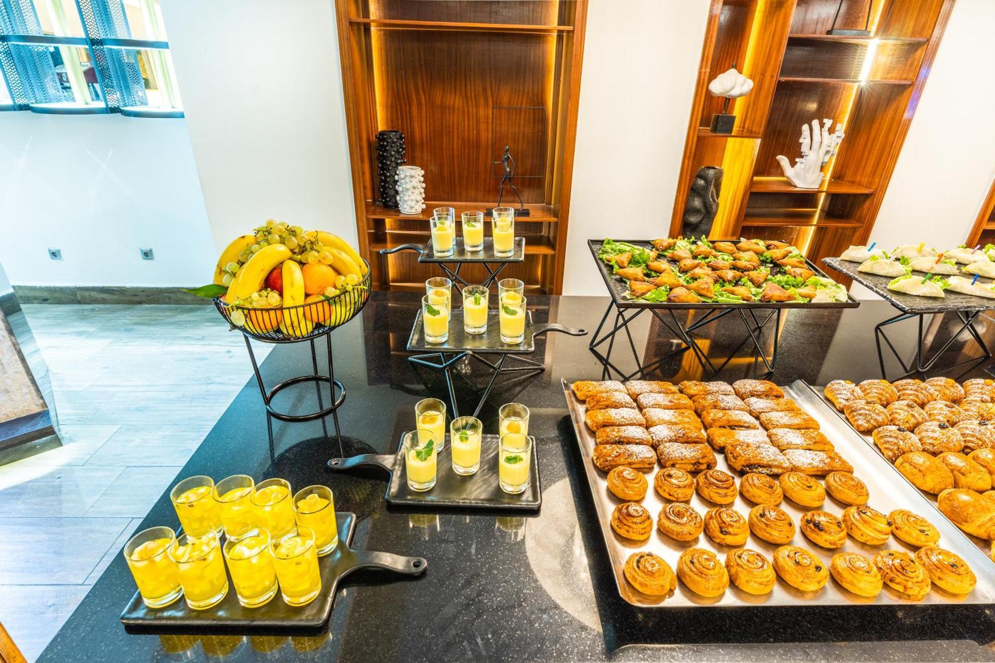 One Hotel Casablanca Bagian luar foto A selection of desserts at a buffet